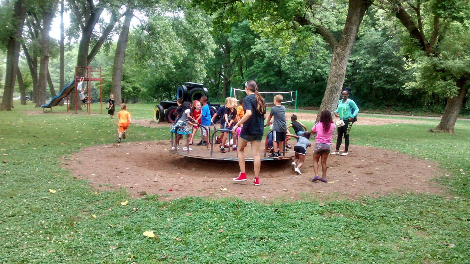 Children and educators gathered in an outdoor learning environment